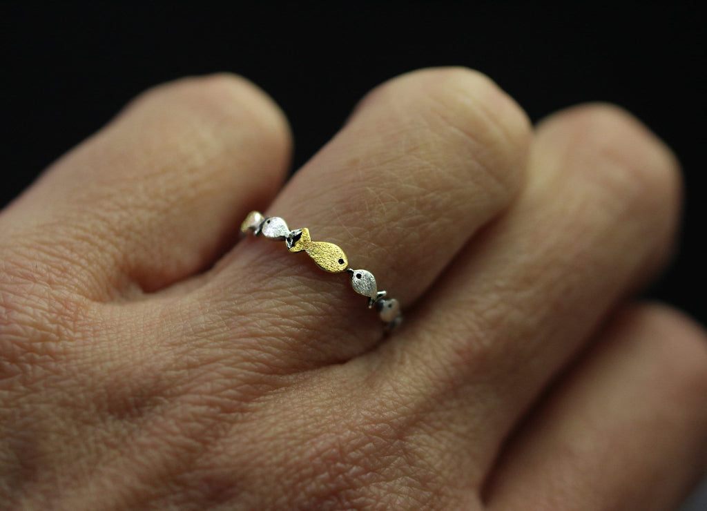 Swimming against the current. Dainty sterling silver ring. School of fish with a golden one swimming upstream. Gift for her.