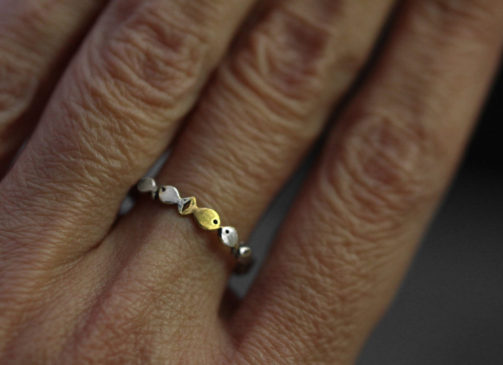 Swimming against the current. Dainty sterling silver ring. School of fish with a golden one swimming upstream. Gift for her.