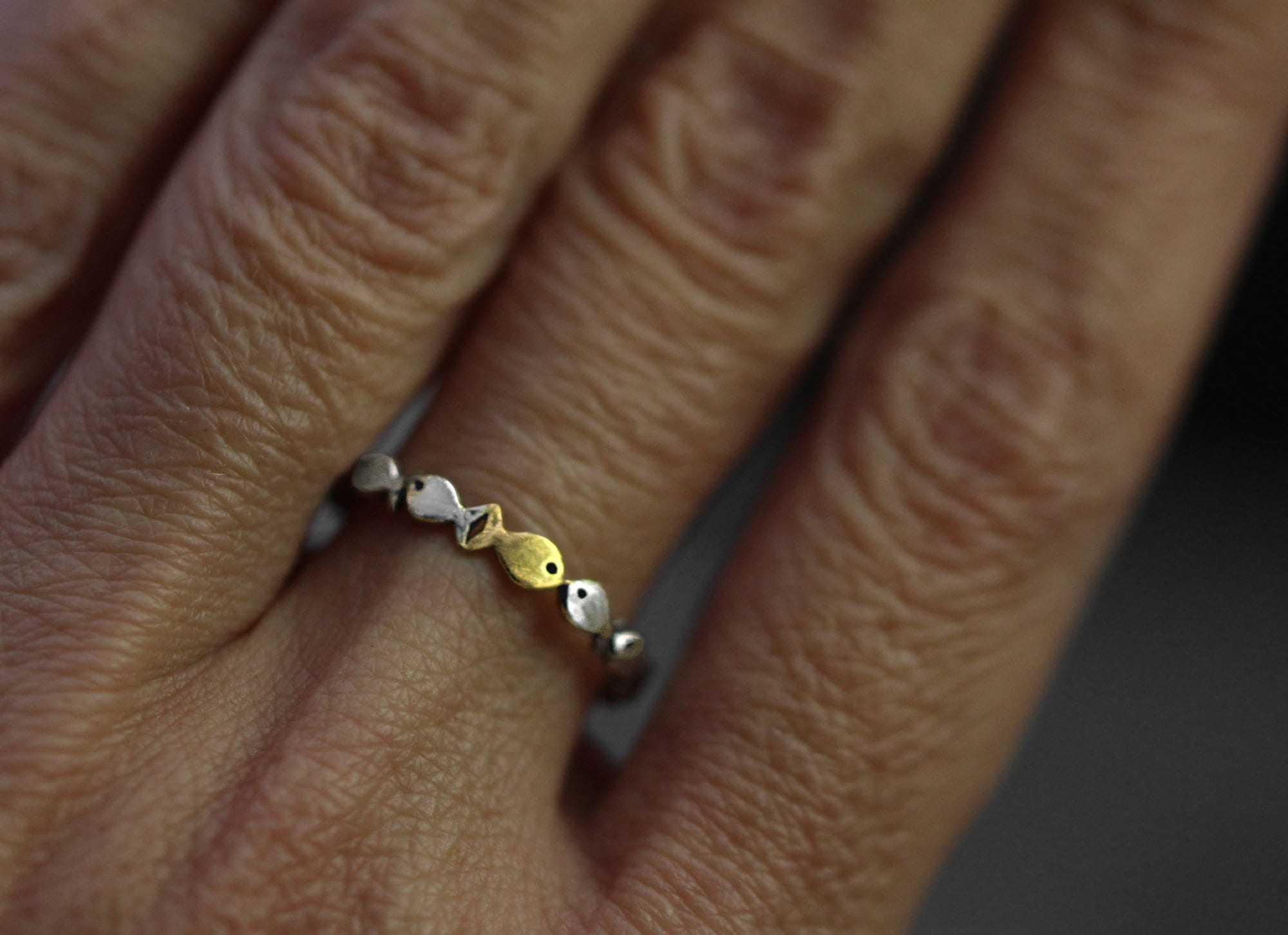 Swimming against the current. Dainty sterling silver ring. School of fish with a golden one swimming upstream. Gift for her.