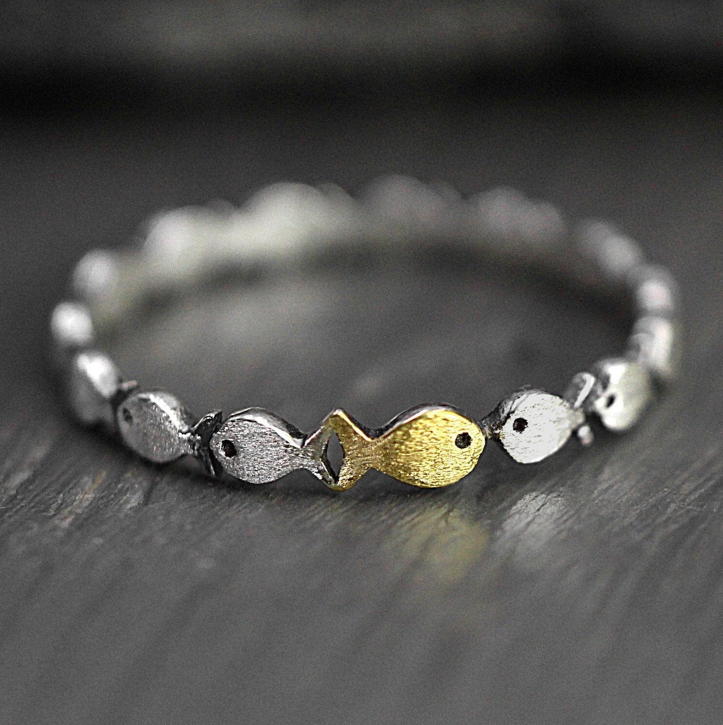 Swimming against the current. Dainty sterling silver ring. School of fish with a golden one swimming upstream. Gift for her.