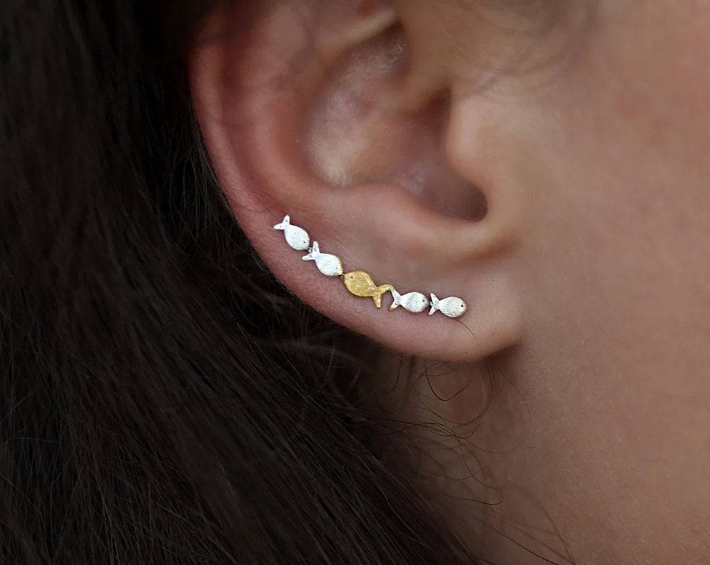 Ear climber Against The Current. Against the tide with one gold fish swimming upstream. Sterling silver fish earrings for her.
