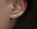 Ear climber Against The Current. Against the tide with one gold fish swimming upstream. Sterling silver fish earrings for her.